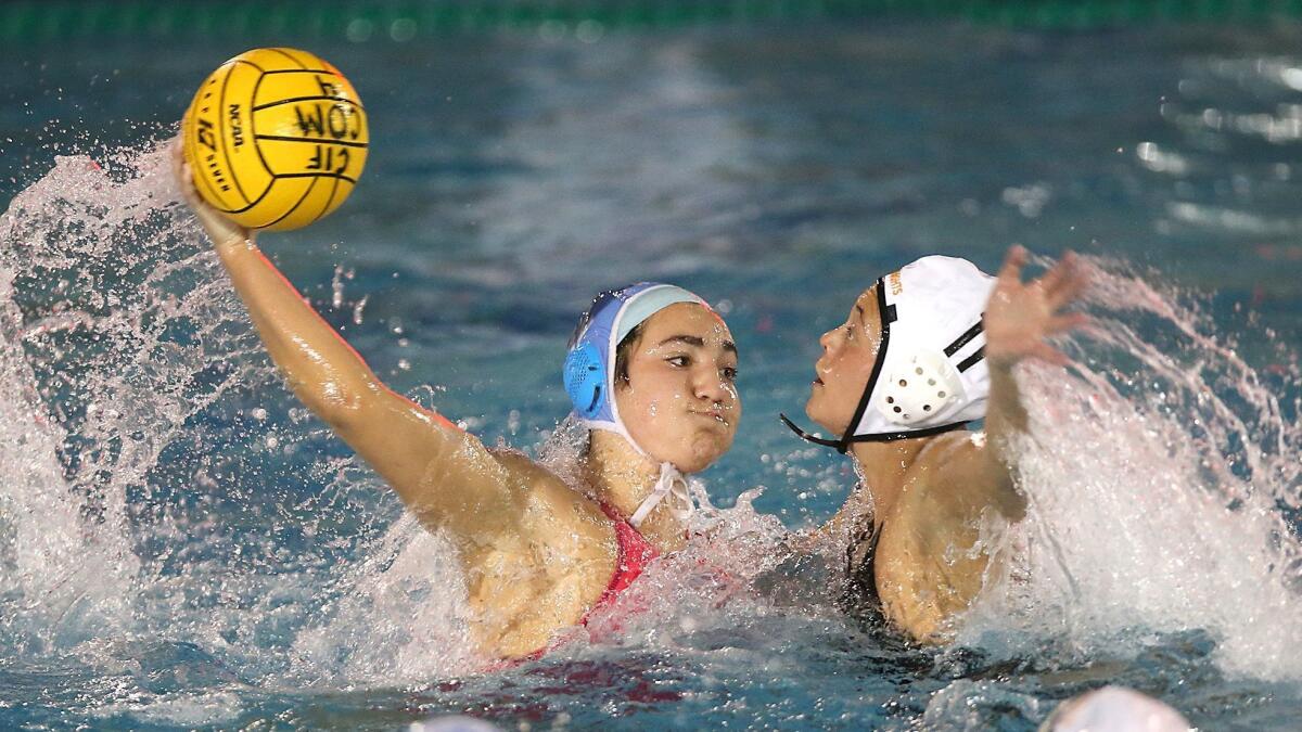 Corona del Mar High's Chloe Harbilas takes a shot while Foothill's Valeria Ayala is defending and she evens things at 7-7 in the quarterfinals of the CIF Southern Section Division 1 playoffs on Thursday.