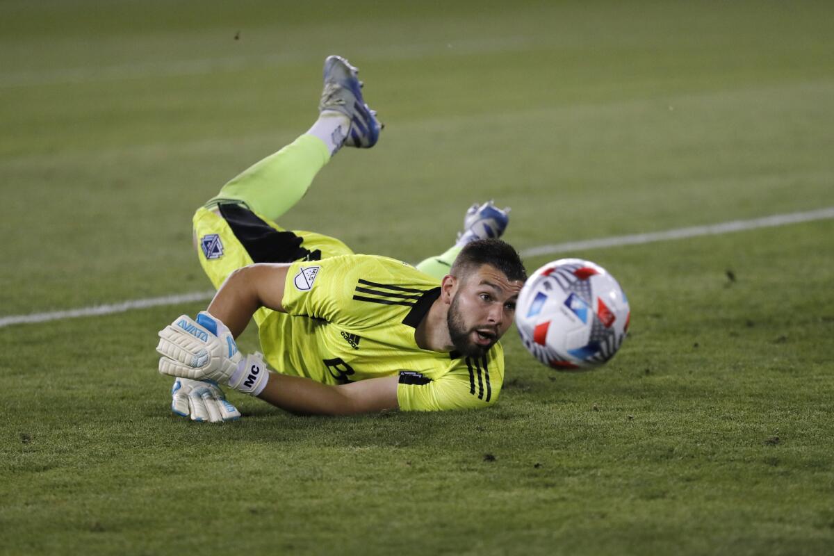 Maxime Crépeau dives to make a save for the Vancouver Whitecaps against the San Jose Earthquakes during a match in August.