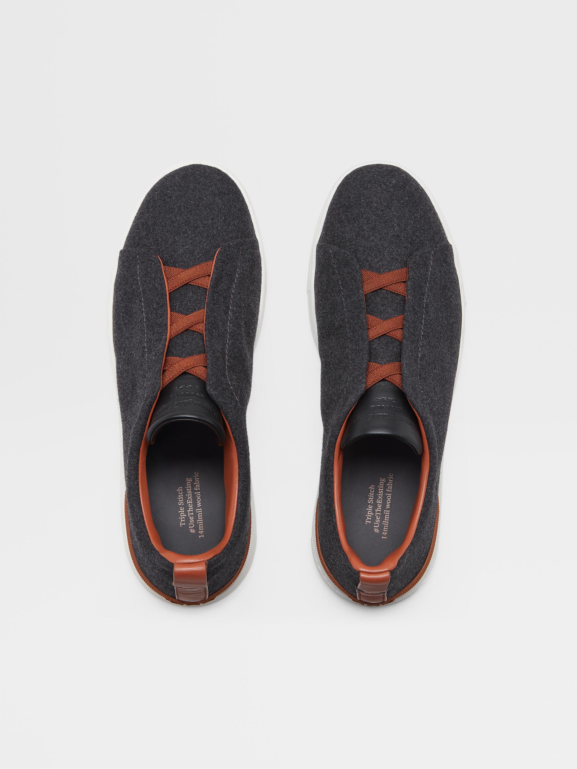 Dark gray Zegna sneakers with orange laces and details