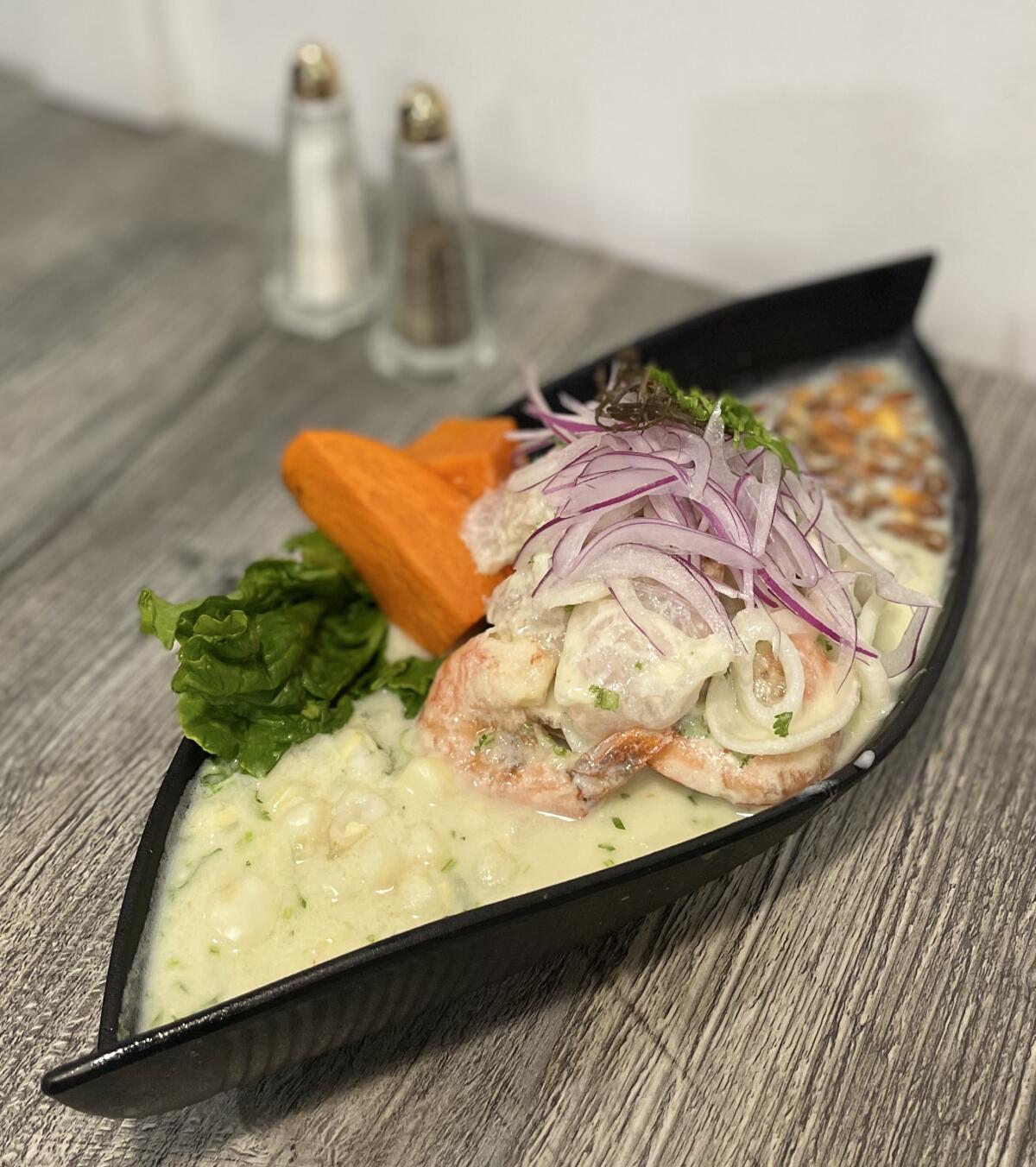 Ceviche 19’s Ceviche Mixto features fish, squid and shrimp cooked in citrus juice dressing.