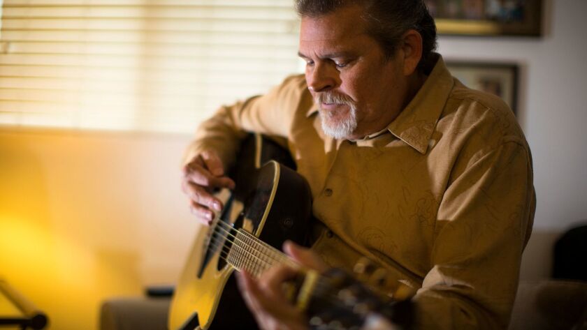 Rehearsing one of his songs at home, gospel artist David Ponder of Ramona is grateful for the MusiCares program for taking care of his living expenses while he recuperates from a heart transplant.