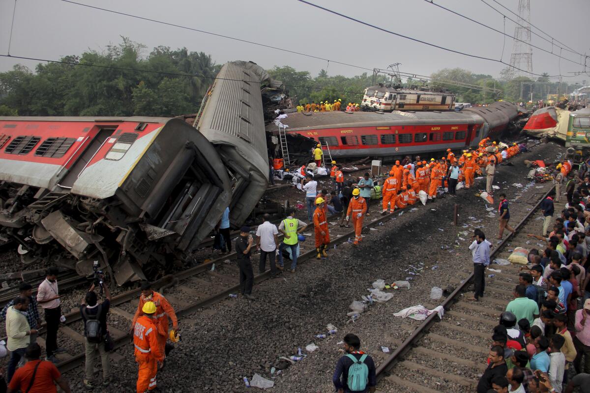 Rescuers at the site of a train crash in the eastern Indian state of Odisha on Saturday.