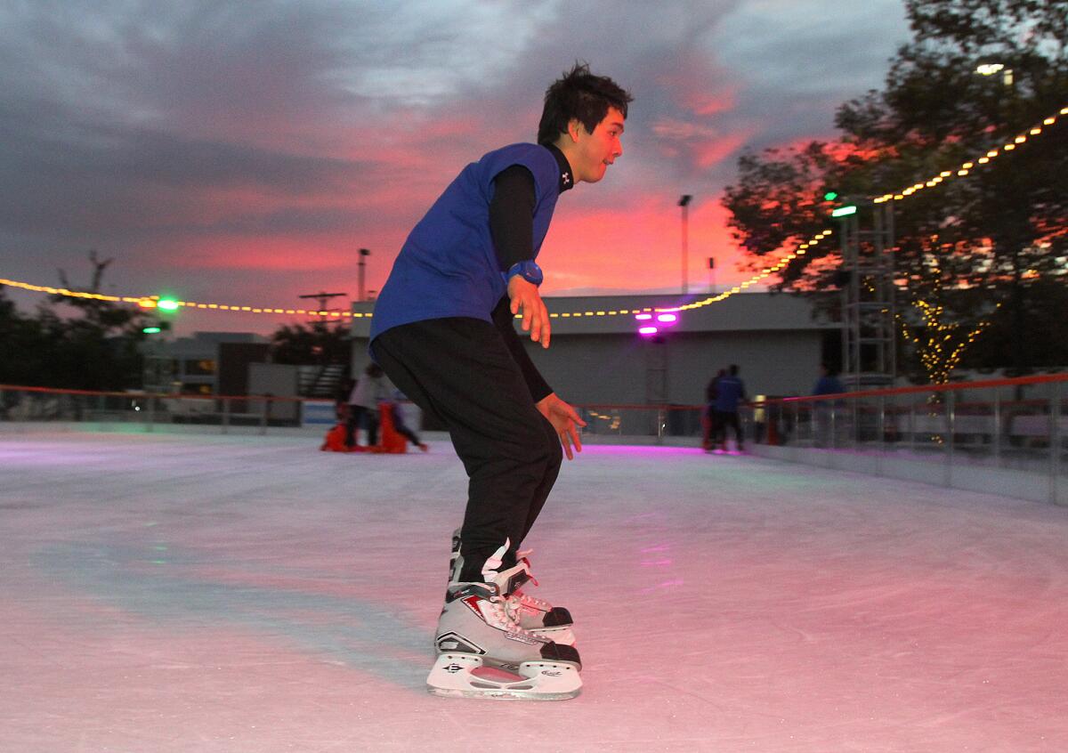 Jeremy Steele, 19, of Burbank, is a skate guard with Skate America, doing some very fast laps on an ice rink behind Burbank City Hall on Friday, November 22, 2013.