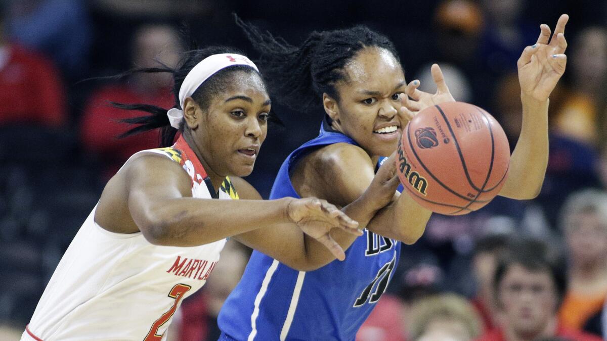 Maryland's Kiara Leslie, left, and Duke's Azura Stevens chase after a loose ball during the first half of Maryland's NCAA tournament regional semifinal victory Saturday.