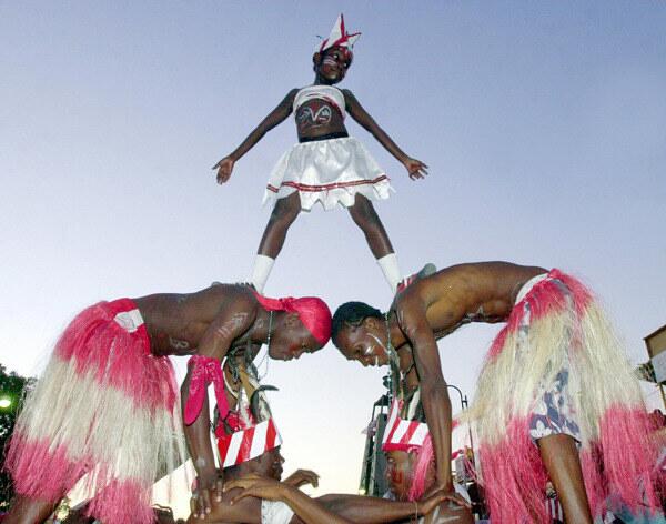 Haitian dancers form a pyramid during Carnival festivities.