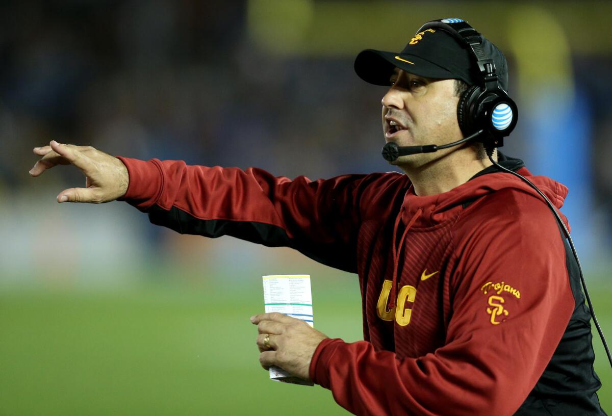 USC Coach Steve Sarkisian signals to his players during game against UCLA at the Rose Bowl on Nov. 22.