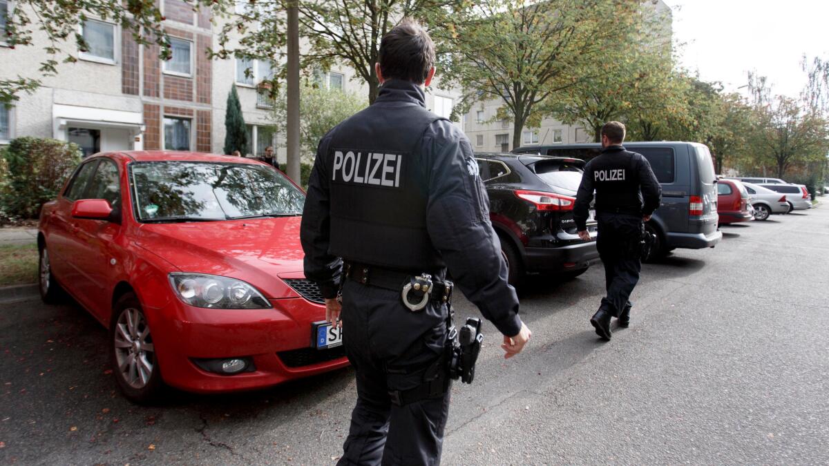 German police stand watch on Oct. 10, 2016, outside the apartment building in Leipzig where Syrian terrorism suspect Jaber Albakr was arrested hours earlier.