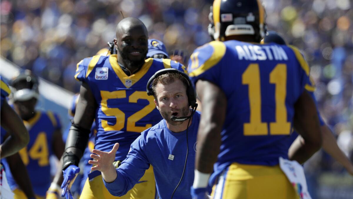 Rams coach Sean McVay reaches out to congratulate receiver Tavon Austin after a first-quarter touchdown against the Seattle Seahawks on Sunday.