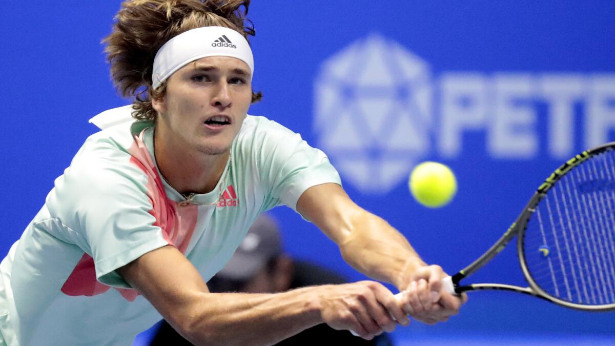 Alexander Zverev stretches to hit a backhand against Stan Wawrinka in the St. Petersburg Open final on Sunday.