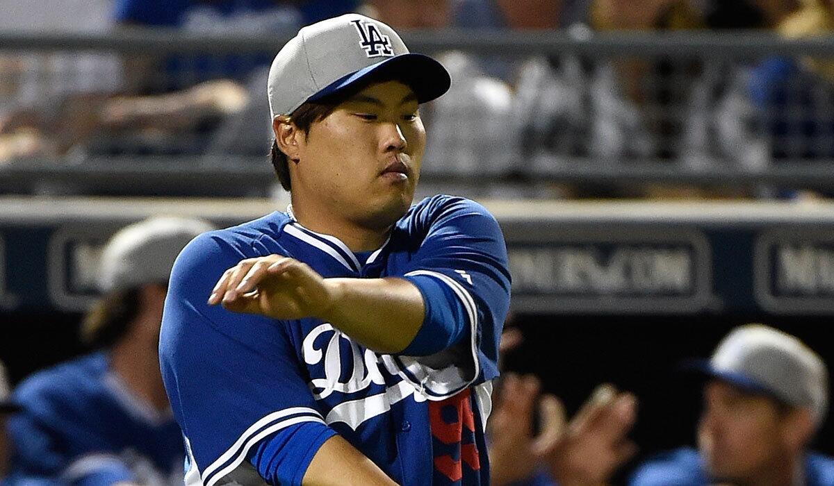 Dodgers pitcher Hyun-Jin Ryu walks onto the field to face the San Diego Padres on March 12.