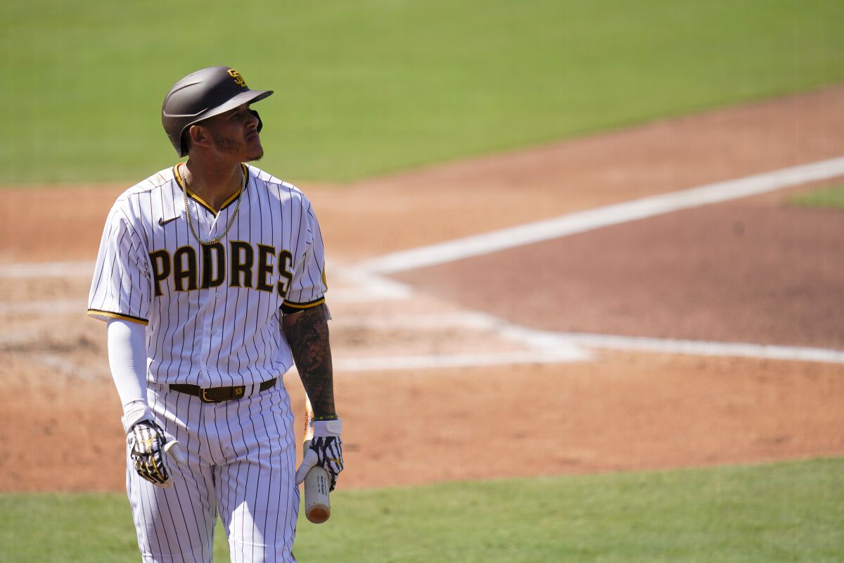 San Diego Padres' Manny Machado looks on after striking out.