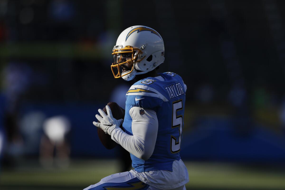 Chargers quarterback Tyrod Taylor warms up before a game.