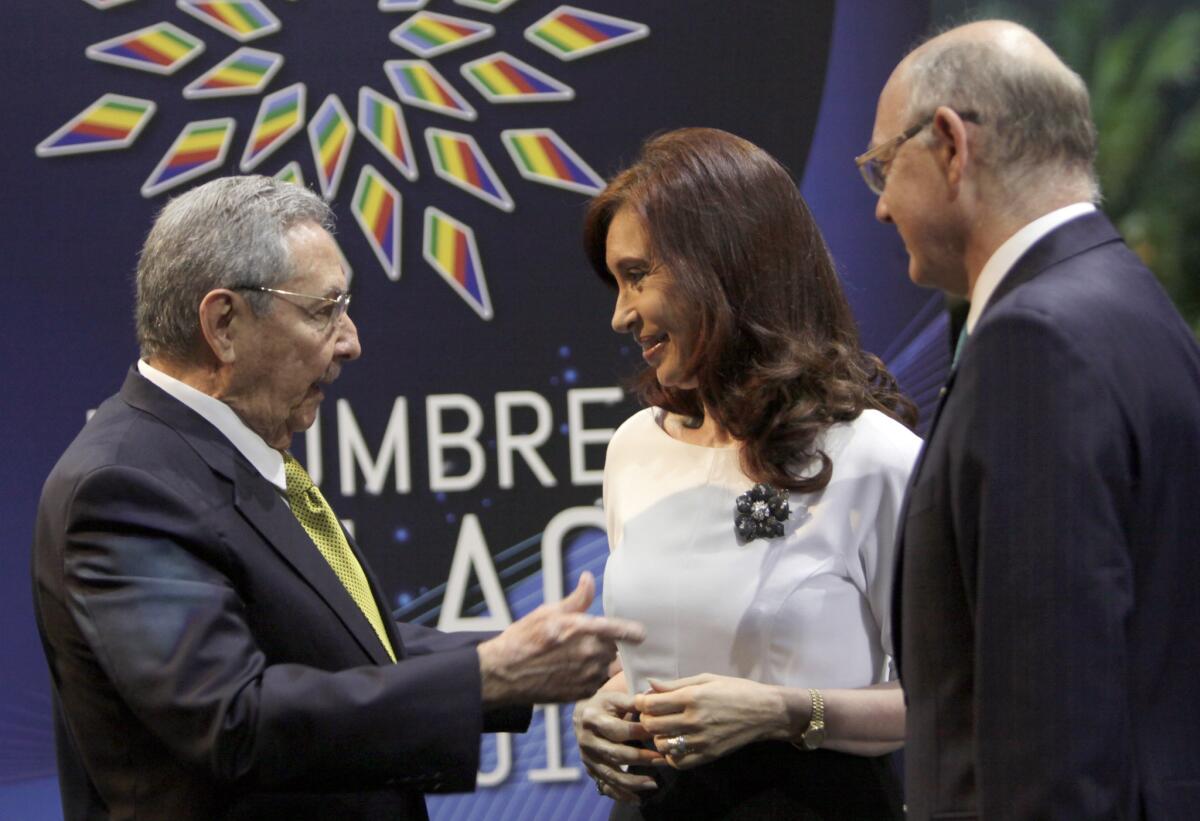 Cuban President Raul Castro, left, greets Argentina President Cristina Fernandez de Kirchner at the Community of Latin American and Caribbean States summit in Havana.