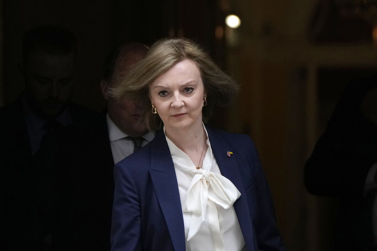 FILE - Elizabeth Truss, Britain's Foreign Secretary leaves a Cabinet meeting at 10 Downing Street in London, Tuesday, April 19, 2022. Britain and the European Union are once again at loggerheads over Brexit on Wednesday, May 11, 2022. The U.K. government has ramped up threats to scrap parts of its trade treaty with the bloc, saying the rules are preventing the formation of a new government in Northern Ireland. (AP Photo/Alastair Grant, File)