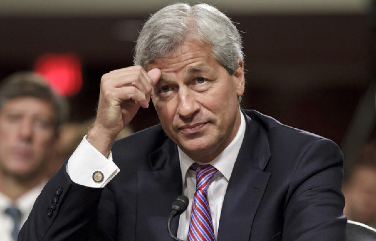 JPMorgan Chase Chairman and CEO Jamie Dimon, shown testifying on Capitol Hill in June 2012, could be pushed out of his dual role.