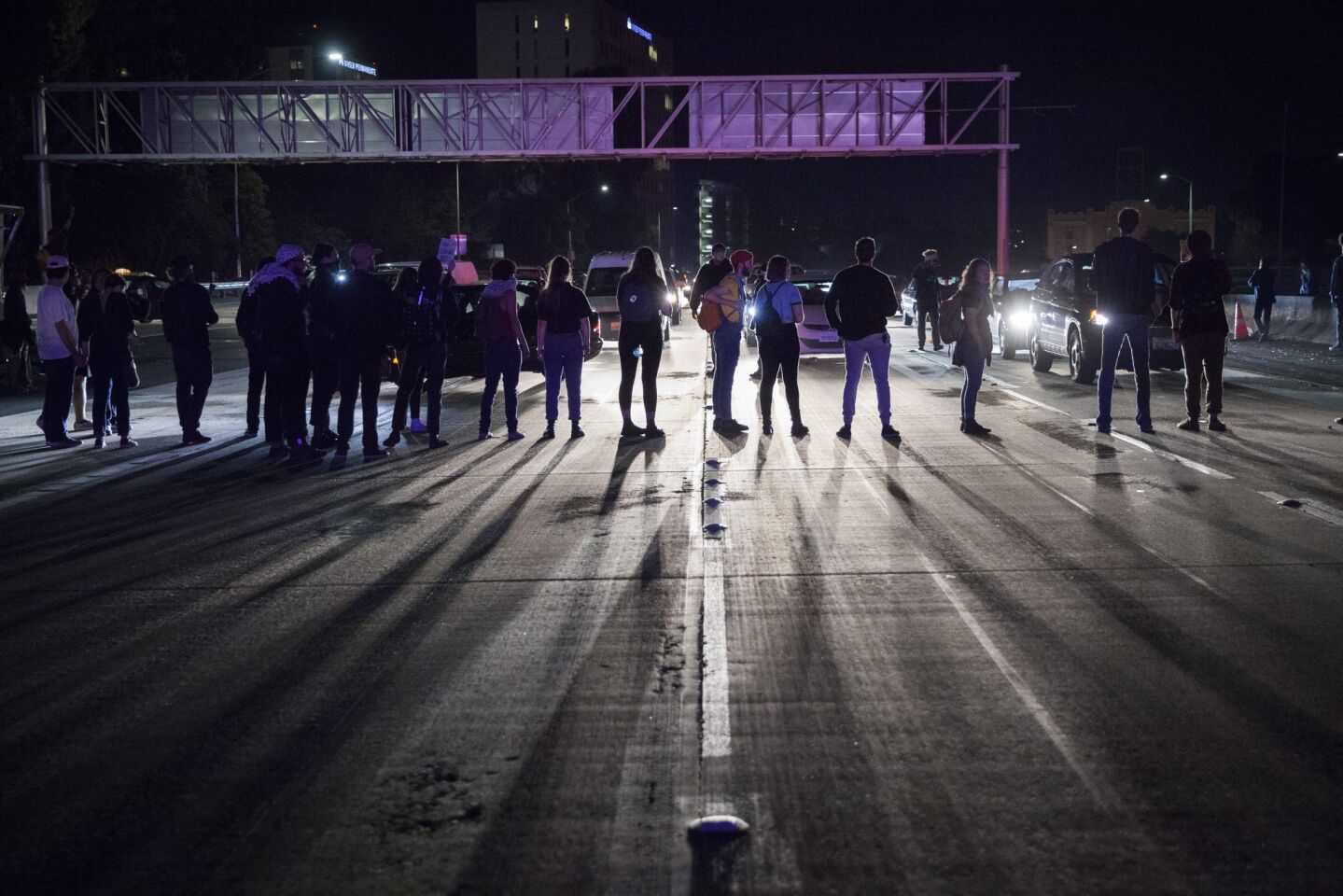 Demonstrators block traffic on the 580 Freeway during a march through the streets in protest against President-elect Donald Trump in Oakland, California.