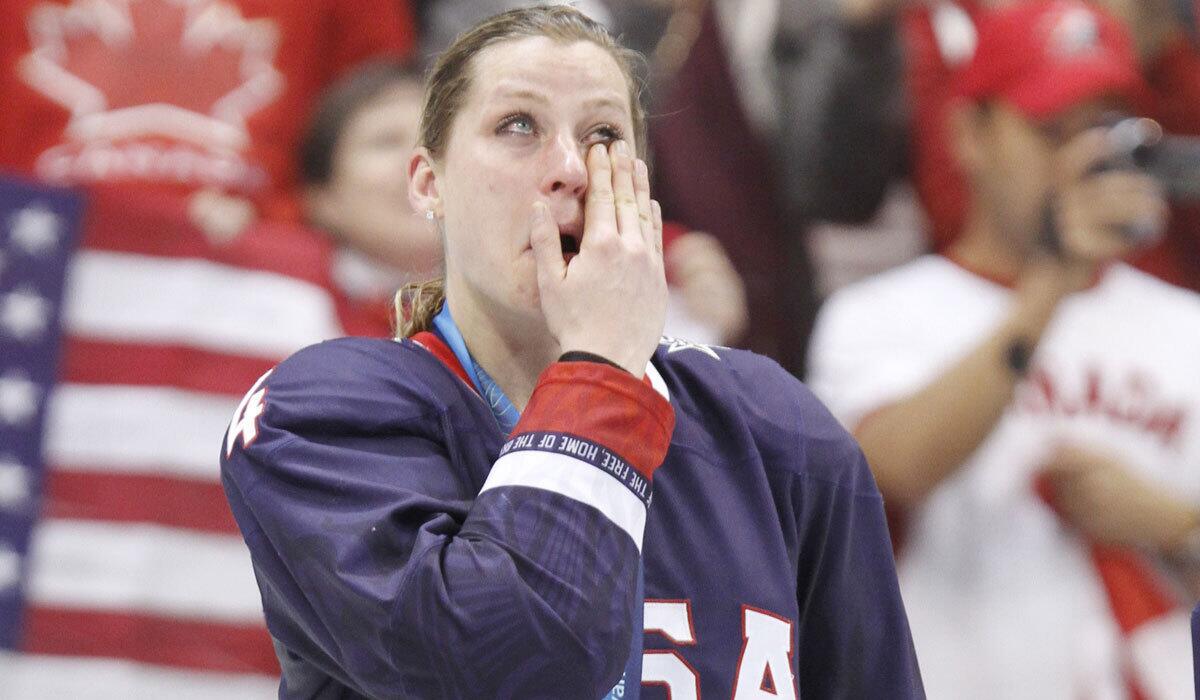 Angela Ruggiero wipes tears after winning a silver medal with the U.S. hockey team at the 2010 Vancouver Winter Olympics.