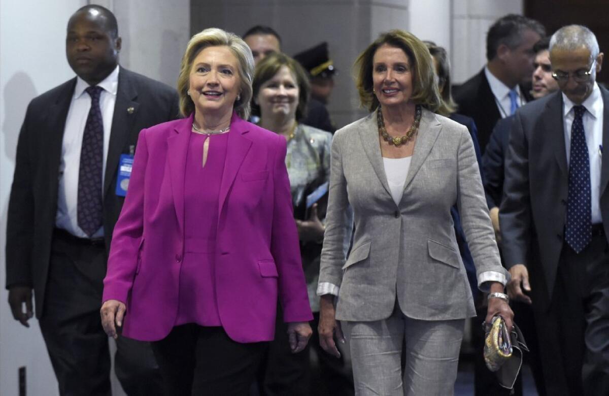 Democratic presidential candidate Hillary Rodham Clinton, left, walks with House Minority Leader Nancy Pelosi (D-San Francisco) at the Capitol after the announcement of a deal with Iran on its nuclear program. Pelosi has not publicly endorsed a presidential candidate.
