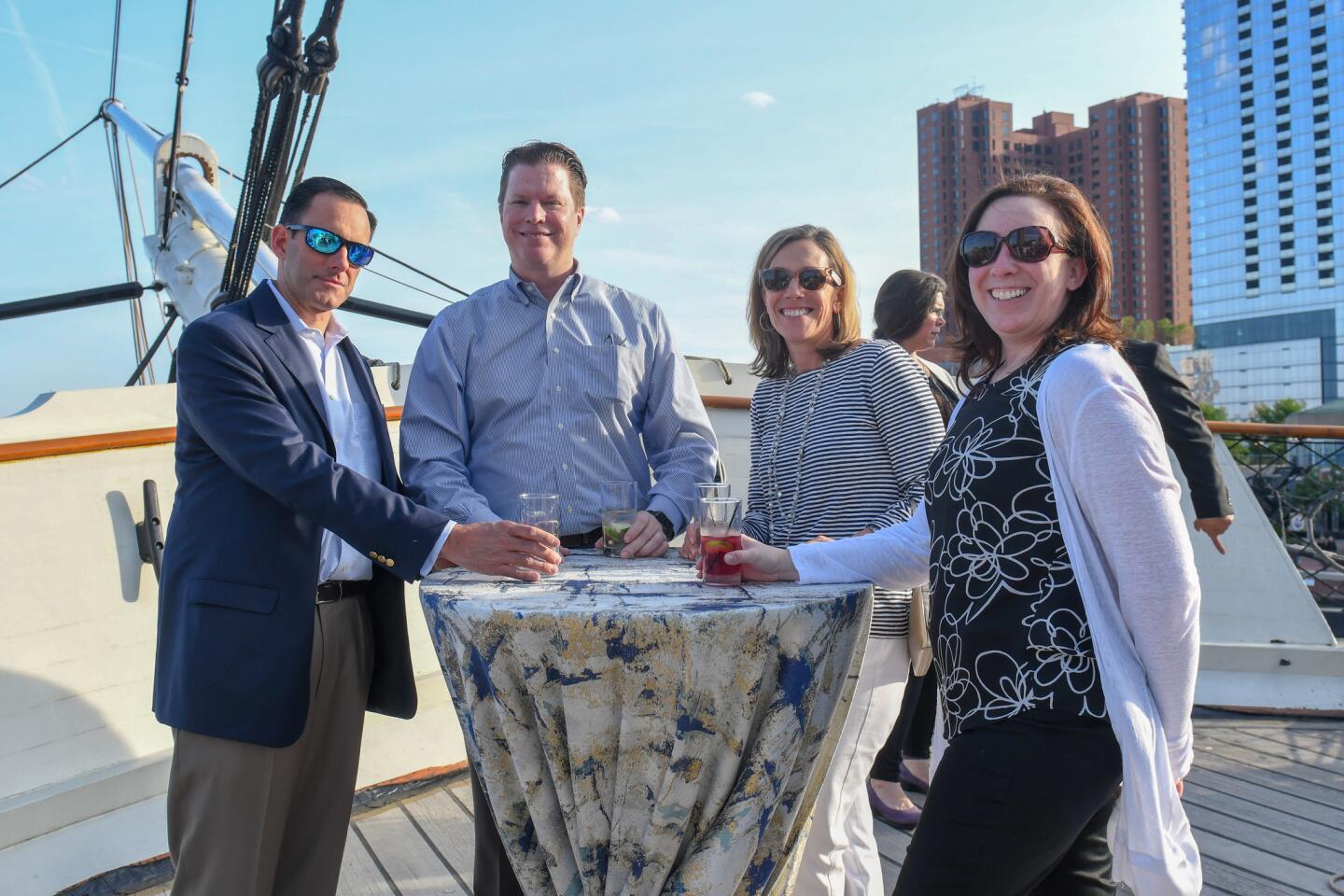 David Berger, left, William Bradley, Missy Berger and Trish Bradley attended Historic Ships' Captain's Jubilee on board the USS Constellation.