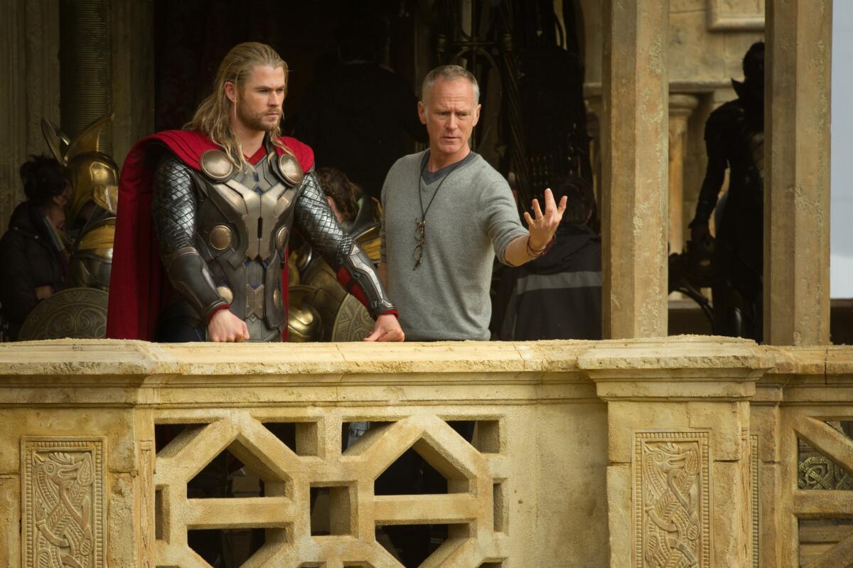 Thor (Chris Hemsworth) on set of "Thor: The Dark World" with Director Alan Taylor.