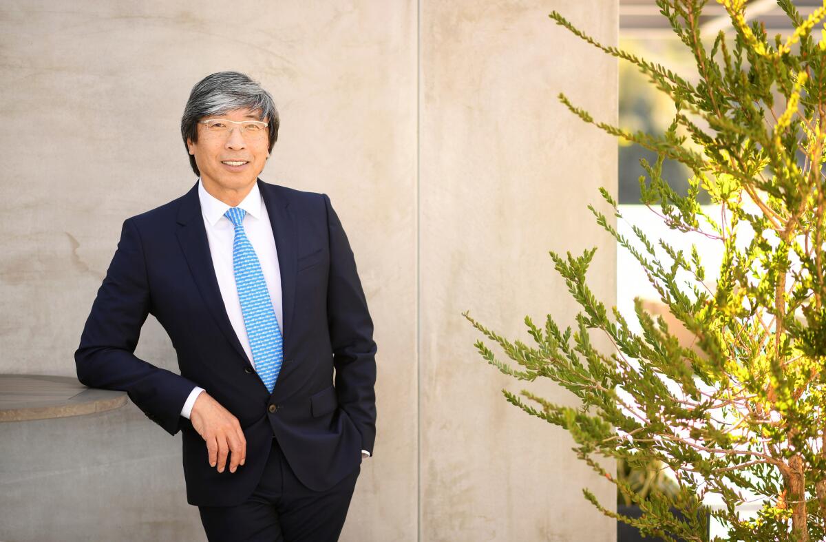 Dr. Patrick Soon-Shiong poses for a portrait in a suit outside his office building