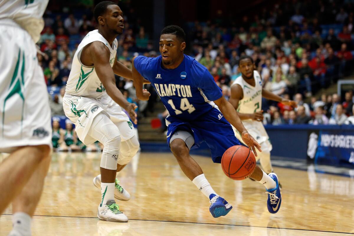 Hampton's Brian Darden drives to the basket during the Pirates' 74-64 victory over the Manhattan Jaspers in the first round of the NCAA Tournament.