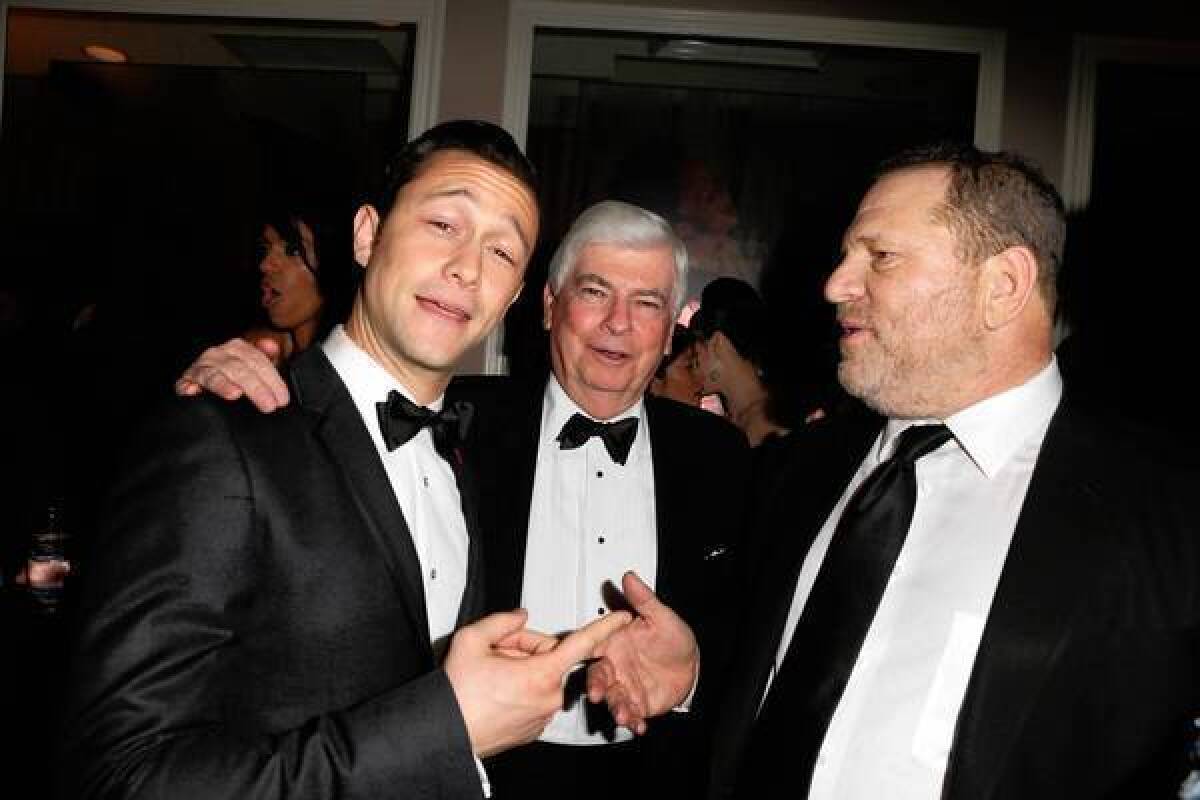 Chris Dodd, center, with Joseph Gordon-Levitt, left, and Harvey Weinstein, broke his anti-lobby pledge when he joined MPAA.