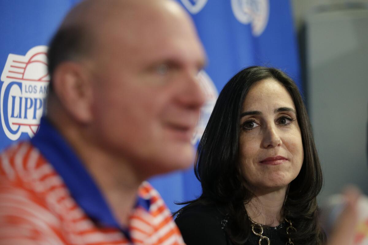 Clippers' new president of business operations Gillian Zucker, right, listens to owner Steve Ballmer during a news conference Saturday morning.