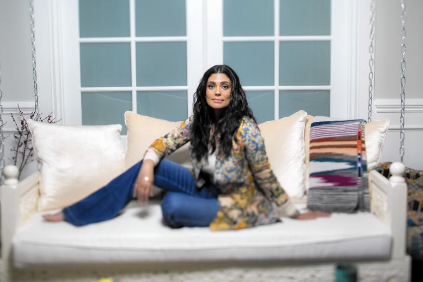 Designer Rachel Roy introduced a plus-size fashion collection, Rachel Rachel Roy Curvy, and is the author of a new book, "Design Your Life: Creating Success Through Personal Style."