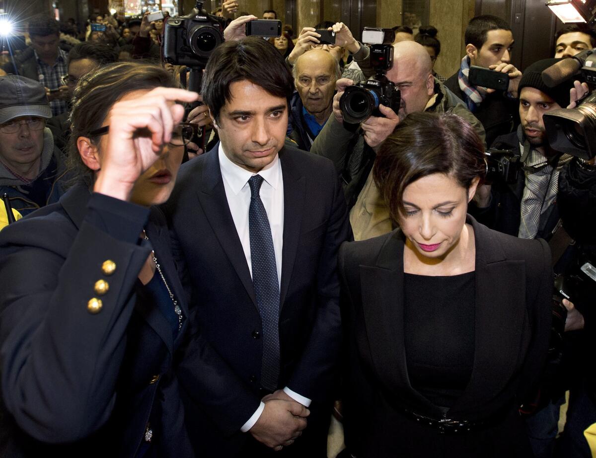Jian Ghomeshi leaves court with his lawyer Marie Henein, right, after being granted bail in Toronto on Wednesday.