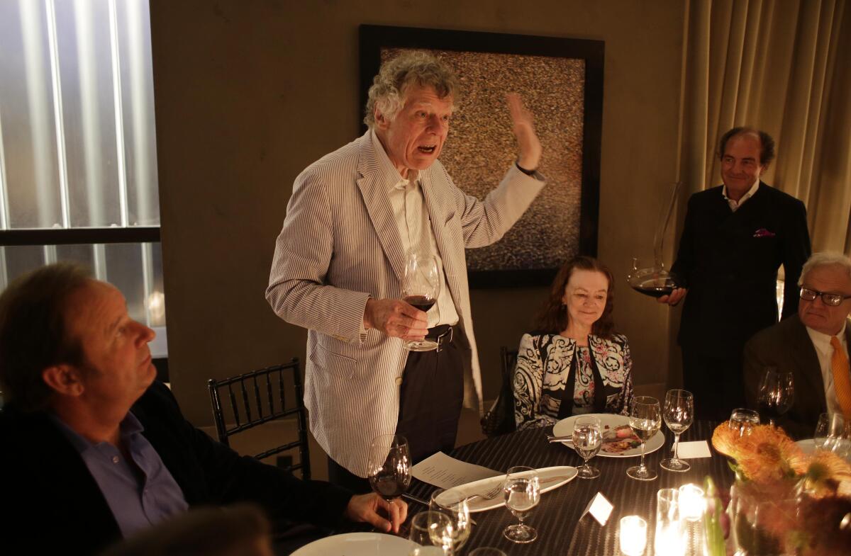 Gordon Getty gestures while speaking about wine bottle closures during an Auction Napa Valley vintners dinner 