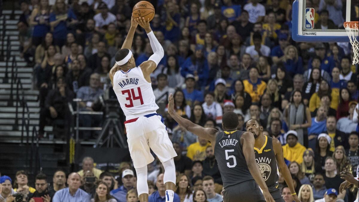 Clippers forward Tobias Harris (34) shoots against the Golden State Warriors in the fourth quarter on Sunday.