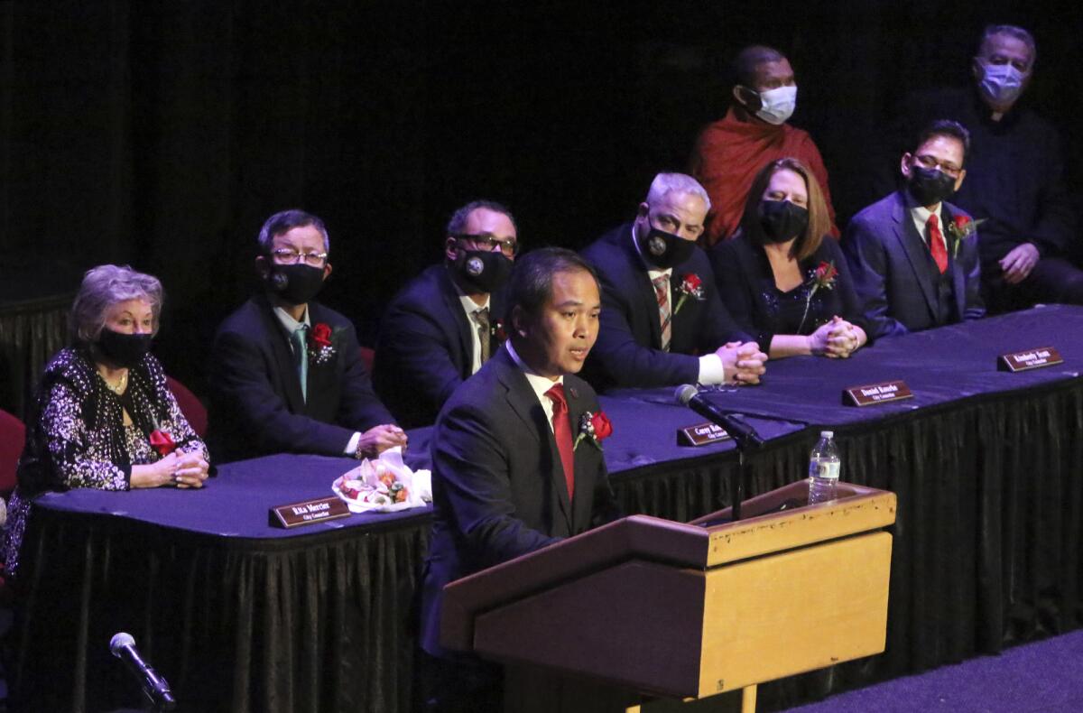 Lowell, Mass., Mayor Sokhary Chau at lectern addressing an assembly