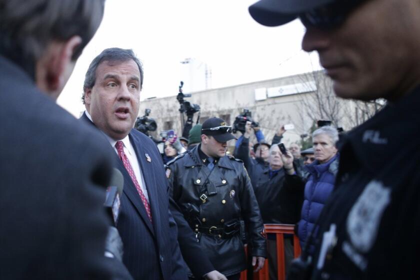 New Jersey Gov. Chris Christie leaves after a visit City Hall in Fort Lee, N.J. on Thursday. Christie traveled to Fort Lee to apologize in person to Mayor Mark Sokolich. Moving quickly to contain a widening political scandal, the governor fired one of his top aides Thursday and apologized repeatedly for the "abject stupidity" of his staff, insisting he had no idea anyone around him had engineered traffic jams to get even with a Democratic mayor.