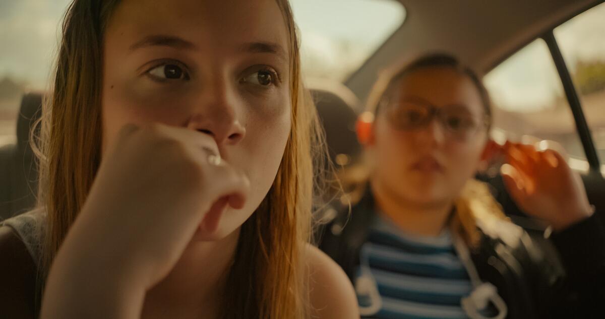 Two teenage girls in a car in the 2021 documentary “Cusp.”