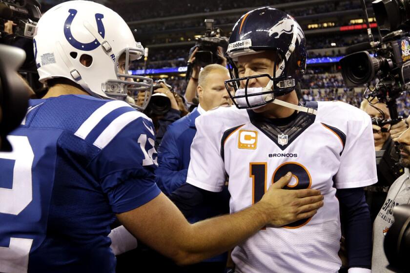 Indianapolis Colts quarterback Andrew Luck, left, speaks with Denver Broncos quarterback Peyton Manning after they met in a game Oct. 20, 2013.