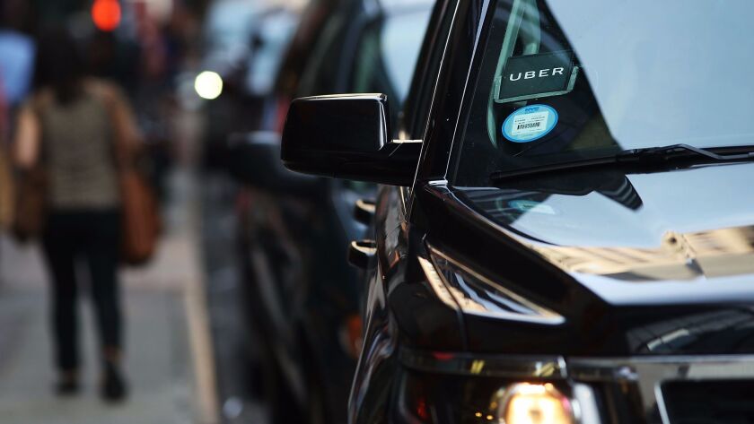 An Uber SUV waits for a client in Manhattan on June 14.