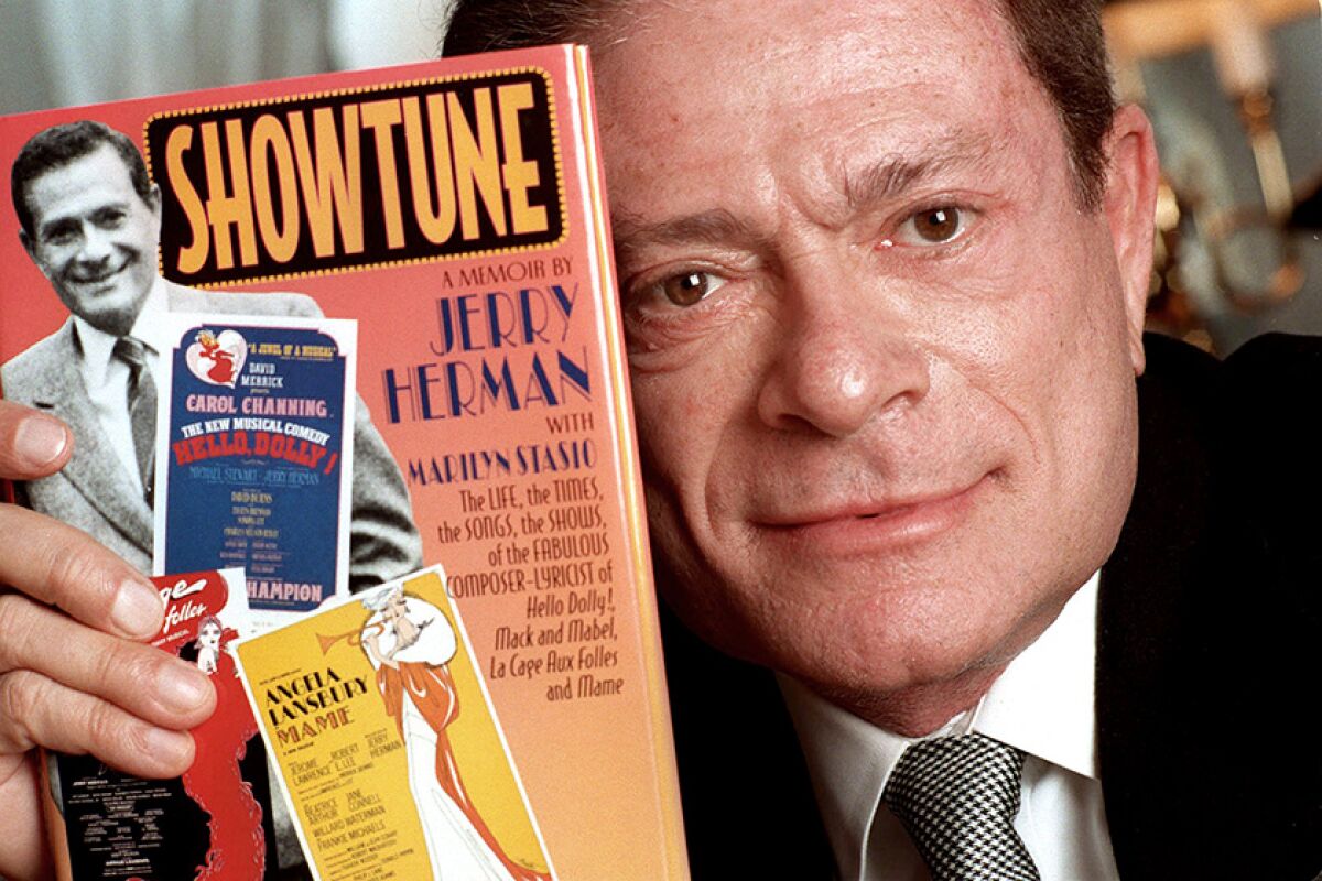 Jerry Herman displays his book, "Showtune," in New York in 1996.