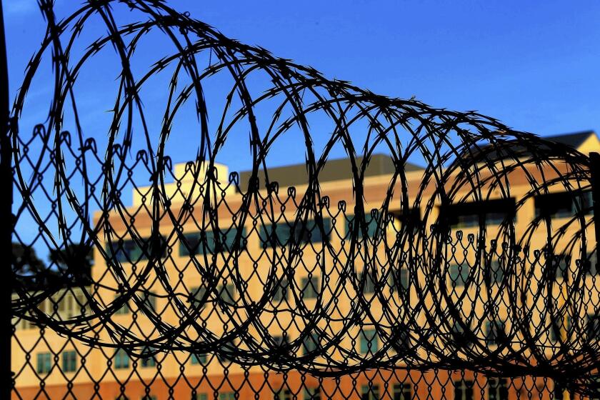 Razor wire encircles the exercise yard at San Quentin. Federal courts have ruled that it is unconstitutional to execute people who are not aware of what is happening to them