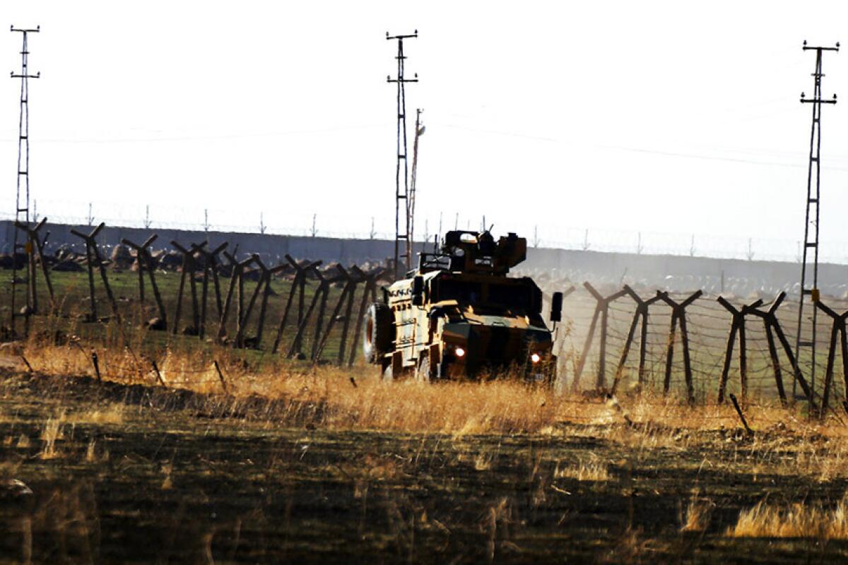 A Turkish army vehicle is driven back into Turkey after being used to conduct a joint patrol with Russian forces in Syria on Nov. 8, 2019.