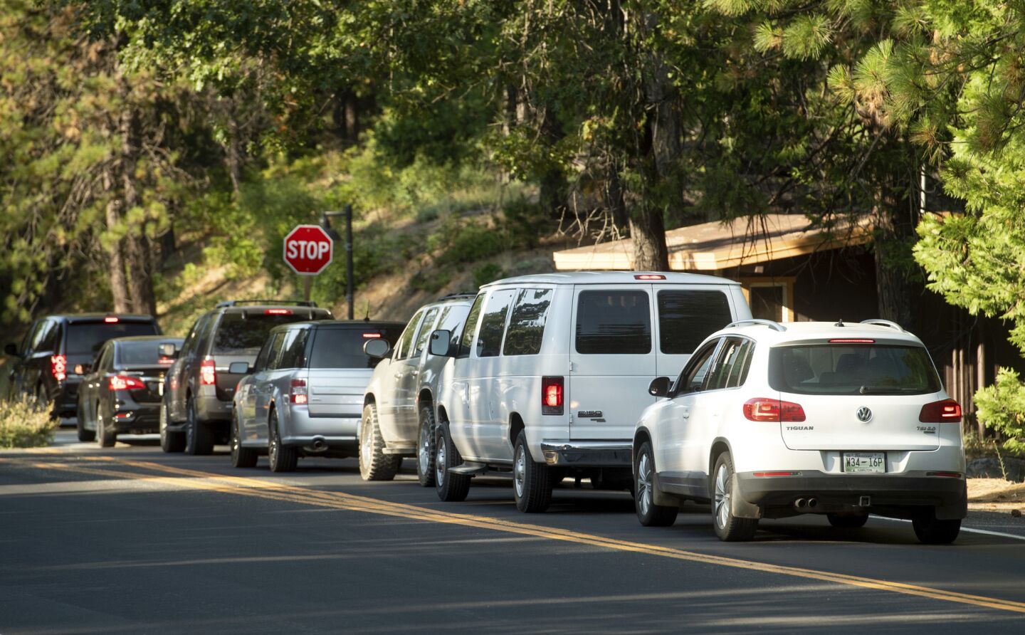 Vehicles leave Yosemite National Park as the Ferguson fire burns nearby.