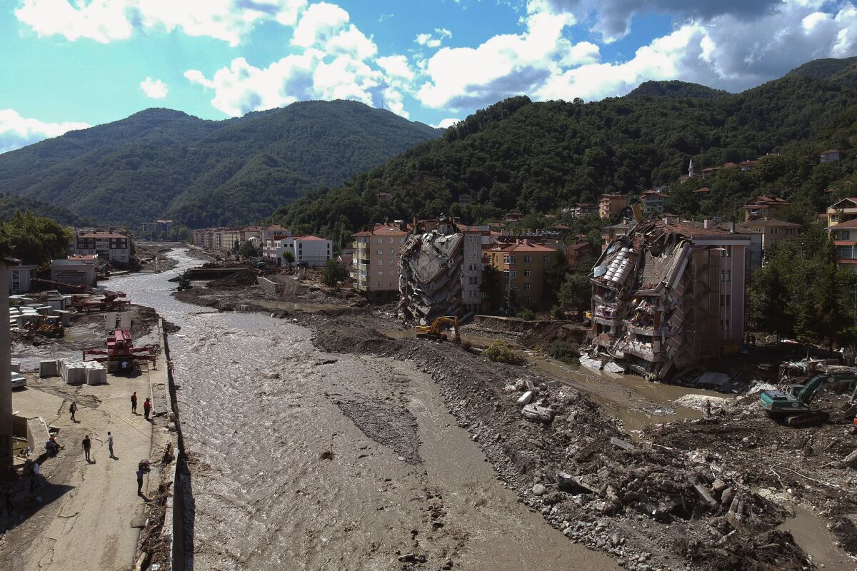 An aerial view of the city center in Bozkurt town of Kastamonu province, Turkey, Sunday, Aug. 15, 2021, after flooding. Turkey sent ships to help evacuate people and vehicles from a northern town on the Black Sea that was hard hit by flooding, as the death toll in the disaster rose Sunday to at least 62 and more people than that remained missing. (AP Photo)
