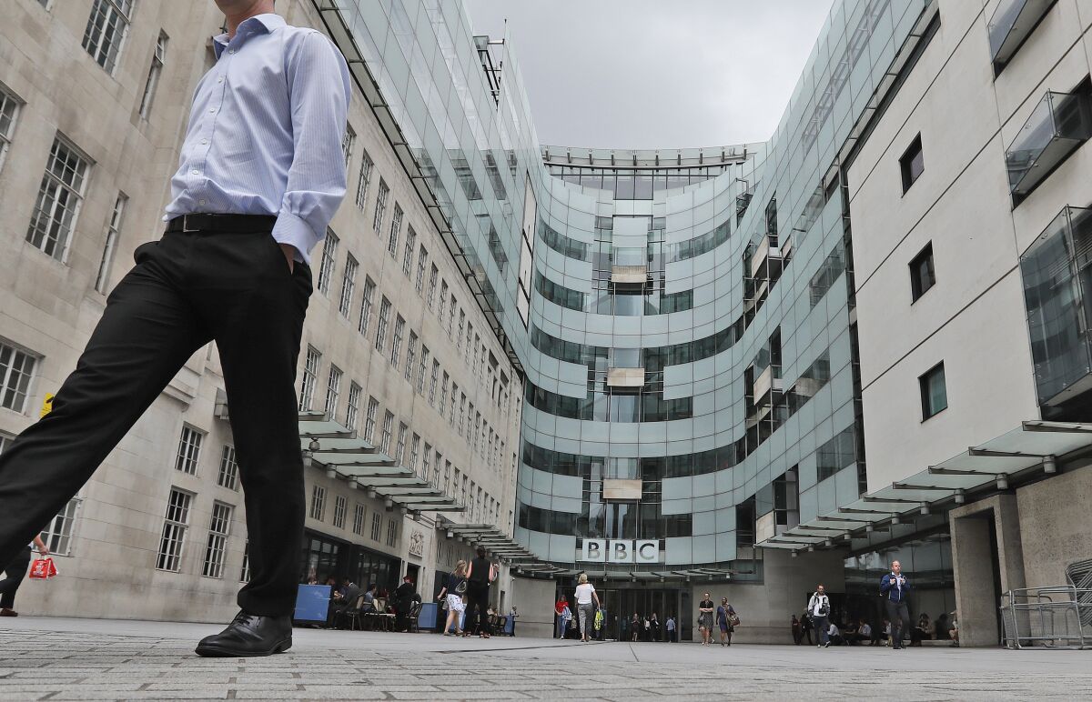FILE - This Wednesday, July 19, 2017 file photo shows the main entrance to the headquarters of the publicly funded BBC in London. British radio host Sideman quit the BBC on Saturday Aug. 8, 2020, over the corporation’s decision to include a racial slur in a news report about a racist attack. (AP Photo/Frank Augstein, File)