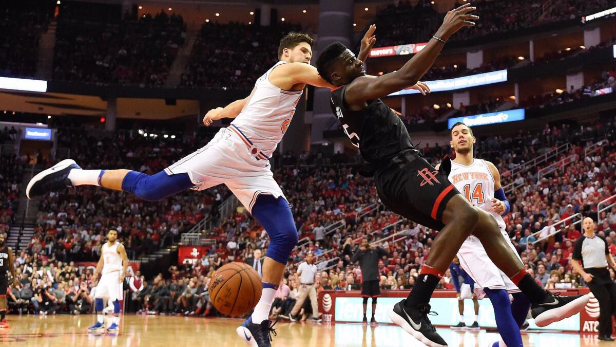 Houston Rockets center Clint Capela is fouled by New York Knicks forward Doug McDermott during the second half. McDermott was assessed a flagrant-one foul on the play.