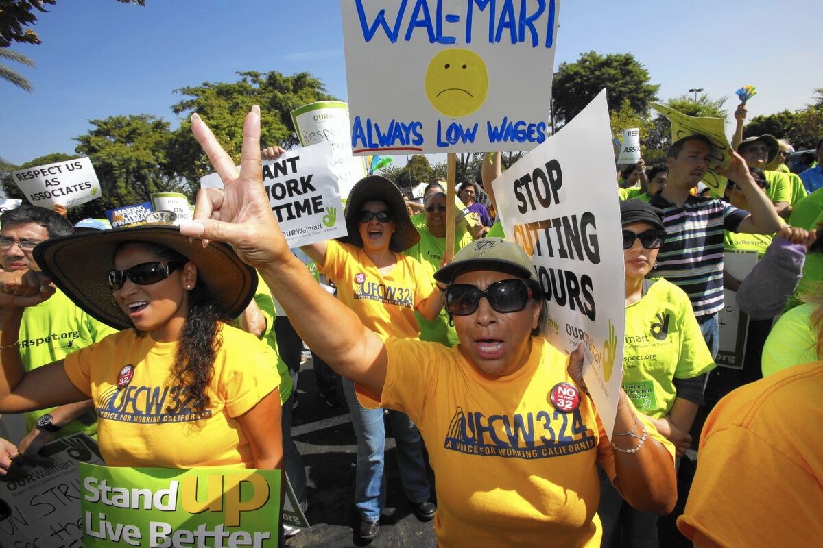 Several hundred Wal-Mart workers stage a walkout and protest in front of the Pico Rivera store in 2012.