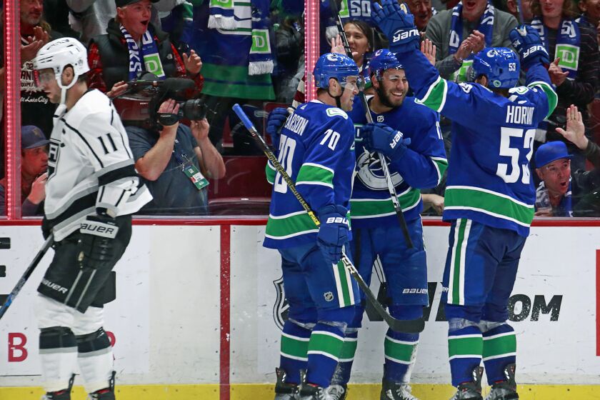 VANCOUVER, BC - OCTOBER 9: Josh Leivo #17 of the Vancouver Canucks is congratulated by teammates Bo Horvat #53 and Tanner Pearson #70 after scoring during their NHL game at Rogers Arena October 9, 2019 in Vancouver, British Columbia, Canada. Vancouver won 8-2. (Photo by Jeff Vinnick/NHLI via Getty Images)