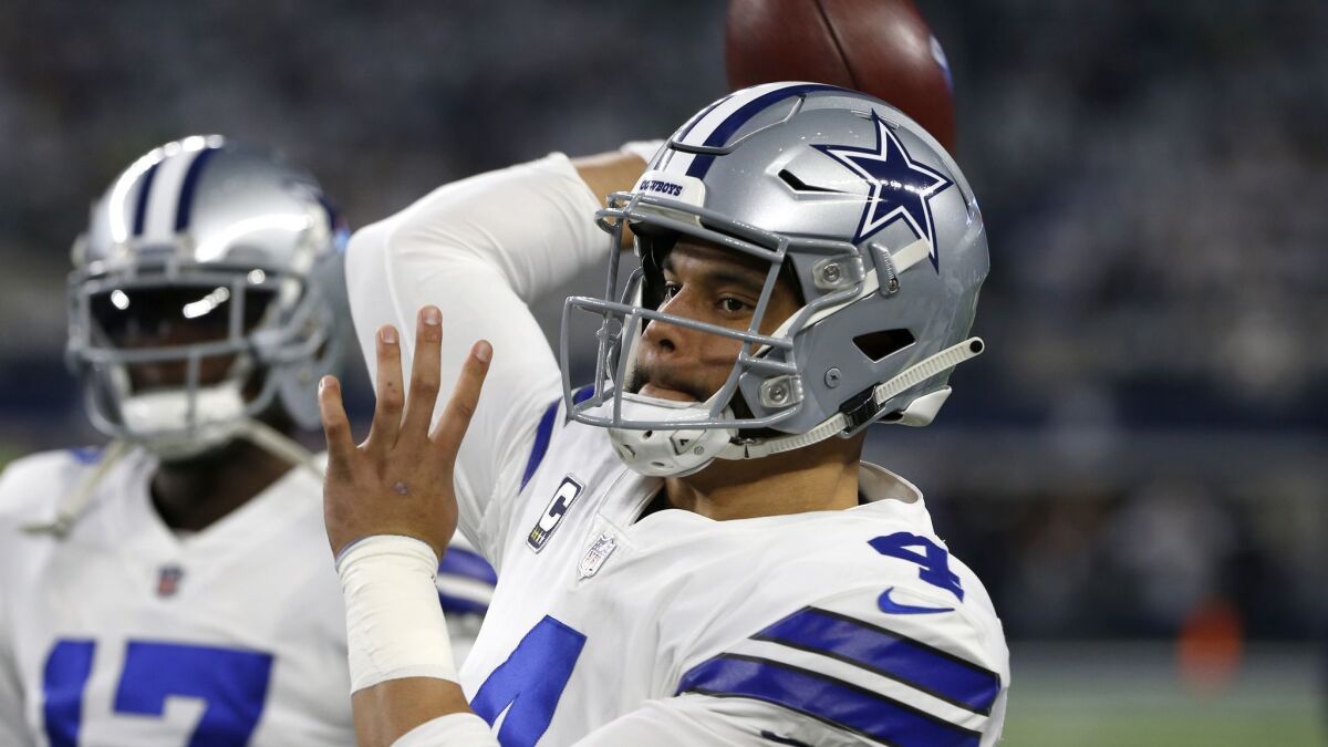 Dallas Cowboys quarterback Dak Prescott throws a pass during warmups before a wild-card game against the Seattle Seahawks in Arlington, Texas, on Saturday.