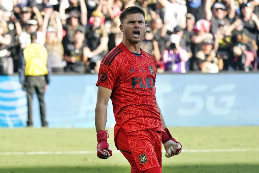 Los Angeles FC goalkeeper John McCarthy (77) celebrates after making a stop during a penalty kick shootout.
