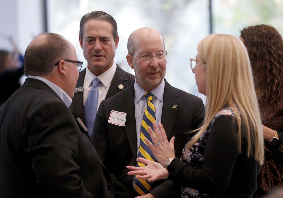 Costa Mesa Mayor John Stephens, O.C. Dist. Atty. Todd Spitzer and UCI School of Social Ecology Dean Jon Gould chat.