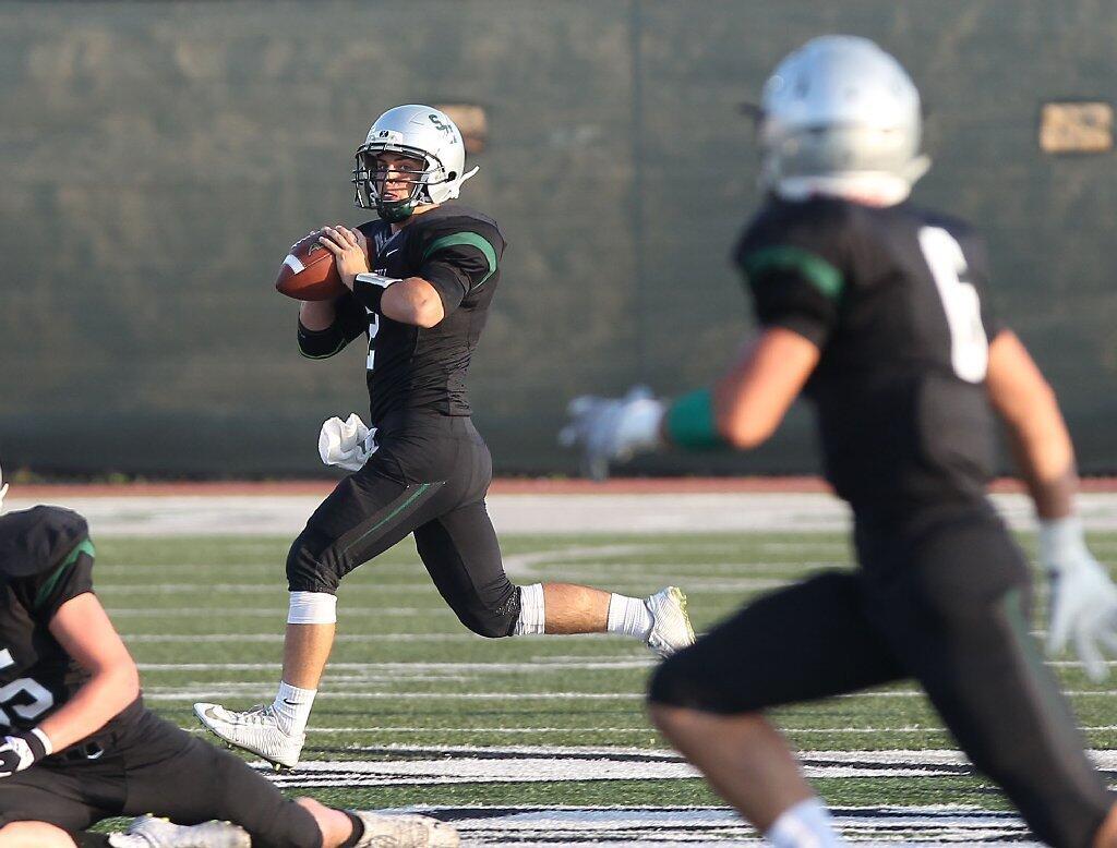 Sage Hill School quarterback Caden Sheetz looks to pass to Jake Fisher in a scrimmage against Century at Sage Hill on Friday.